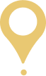 A simple golden location pin icon on a white background.